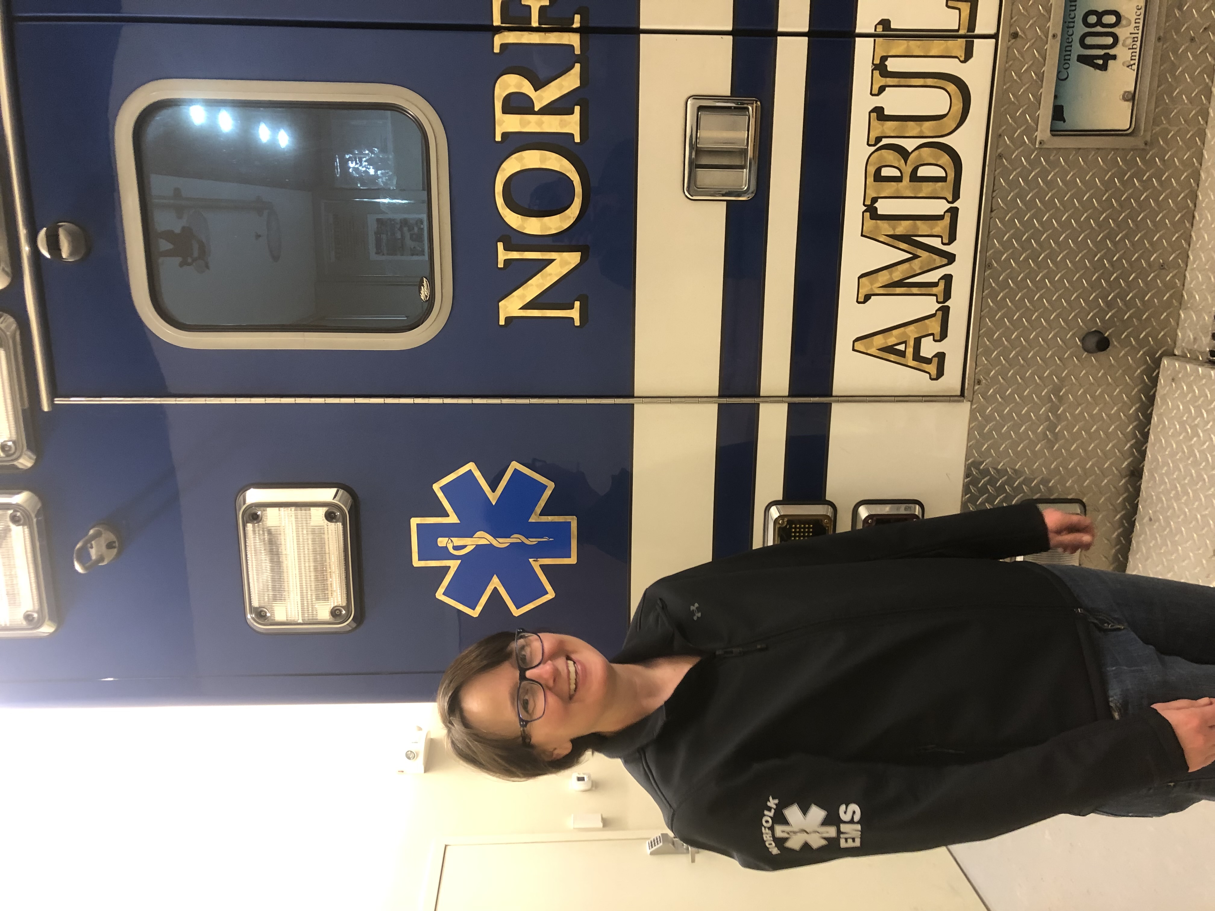 Norfolk EMS volunteer with ambulance